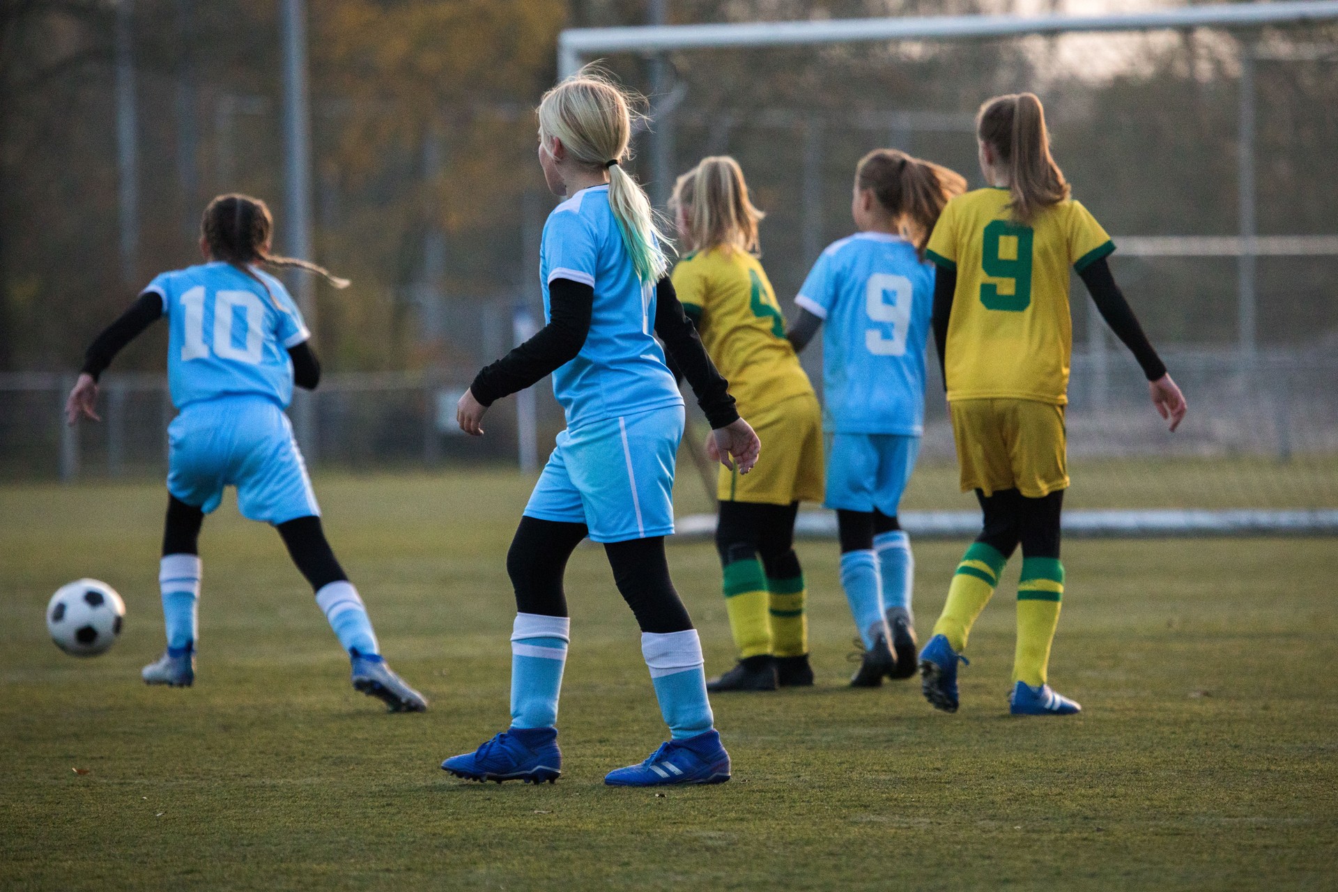 Girls playing soccer during a football match