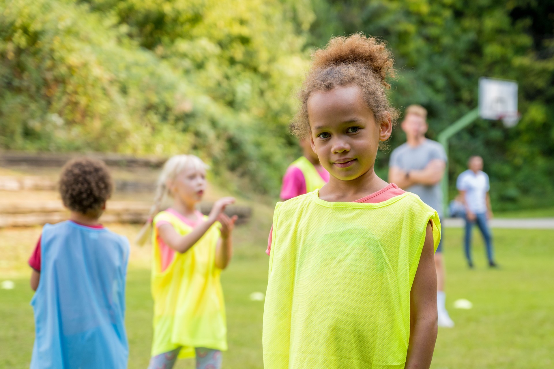 Portrait of girl standing on soccer field